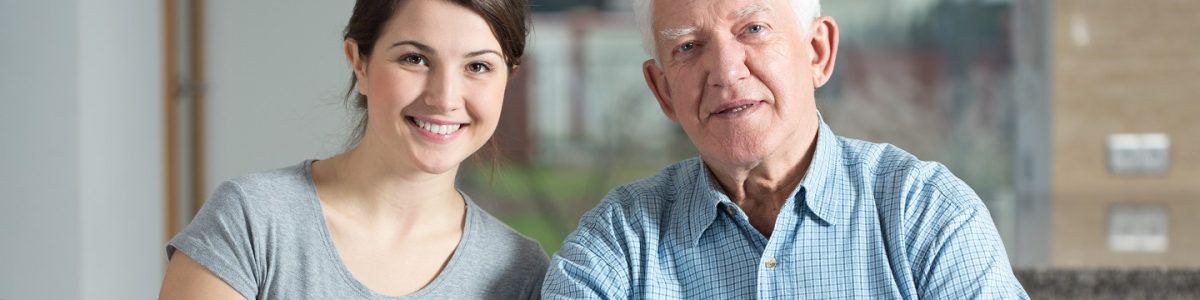 younger woman and older man sitting together